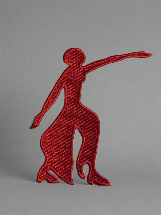 Red embroidered logo of a leaping dog on a beige background